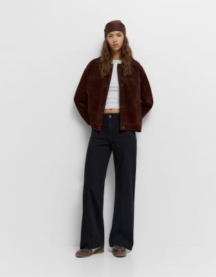 Pull & Bear - Jeans in Schwarz mit aufgesetzten Taschen und weitem Bein