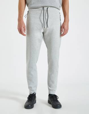 grey joggers with zips