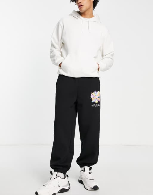 Pull&Bear - Joggers neri con stampa di Kenny Scharf in coordinato