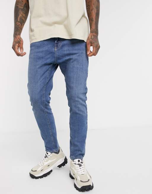 Pull&Bear Join Life – Niebieskie zwężane jeansy o marchewkowym kroju z efektem sprania