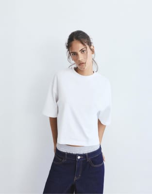 Pull & Bear - Kastiges, kurzärmliges Polohemd in Weiß