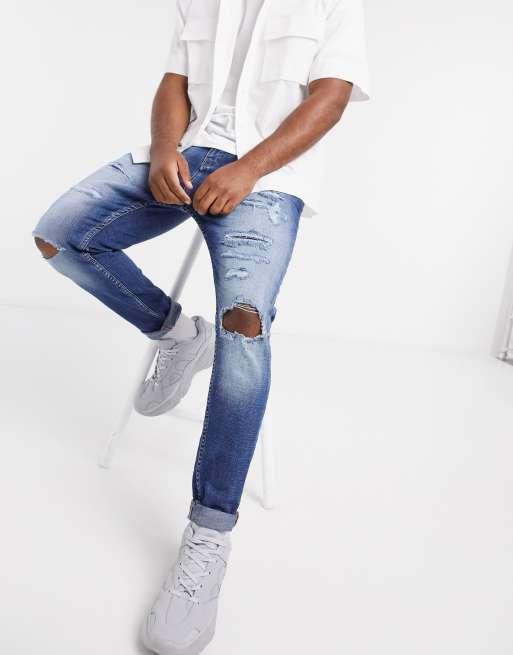 Pull&Bear – Niebieskie jeansy marchewy z dziurami