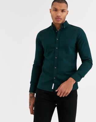 dark green shirt grey pants
