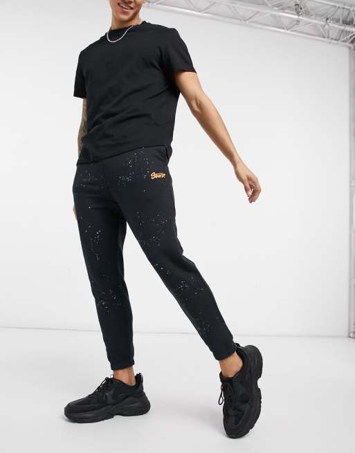 Pull&Bear paint splatter sweatpants in black | ASOS