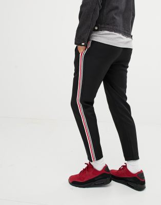 black pants with red side stripe