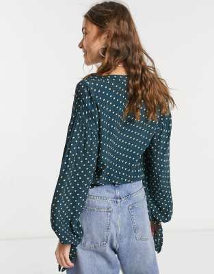 green and black polka dot blouse