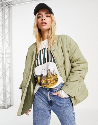 Pull&Bear quilted bomber jacket with borg lining with button front detail in pistachio