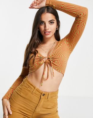Pull&Bear retro swirl long sleeved crop top with ring detail in orange