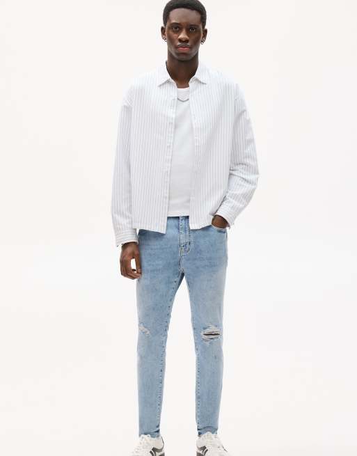 Pull&Bear ripped carrot leg jeans in mid blue