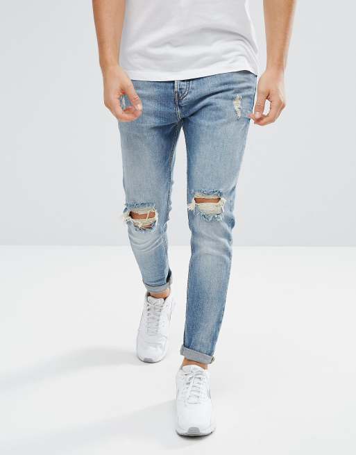 Ripped carrot cheap fit jeans