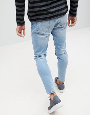 ripped carrot fit jeans