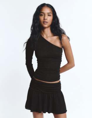 Pull & Bear Ruffled mini skirt with rhinestone draping in black