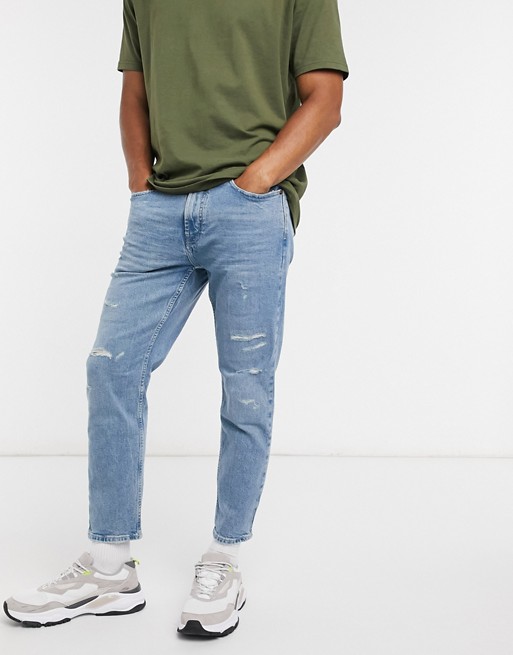 Pull&Bear slim tapered jeans in light blue with rips