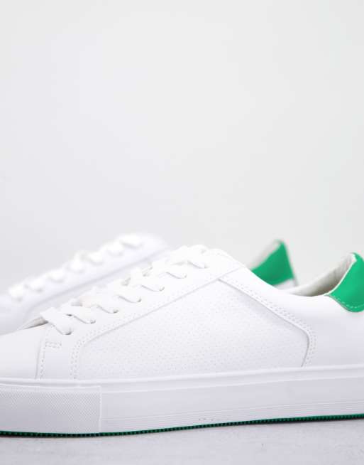 White shoes store with green back