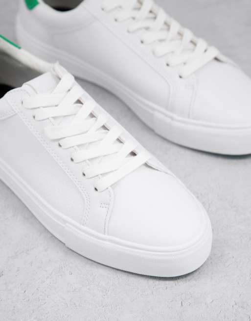 White sneakers shop with green back