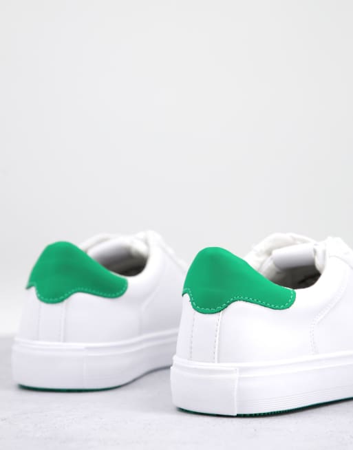 White sneakers with store green back