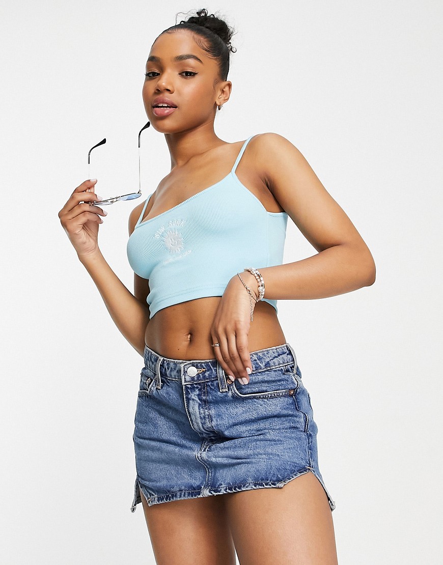 Pull & Bear strappy embroidered graphic cropped vest in blue