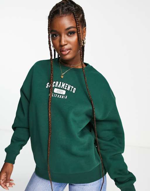 Guinness Afvige Velkommen Pull&Bear sweatshirt with Sacramento slogan in bottle green | ASOS