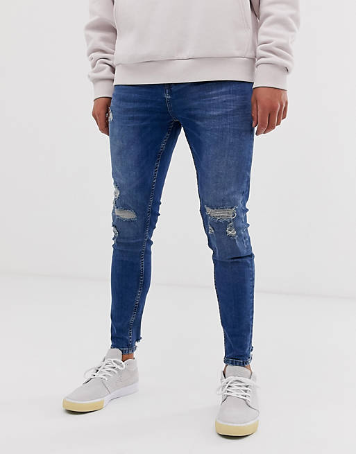 Pull&Bear tapered carrot fit jeans in dark blue with rips | ASOS