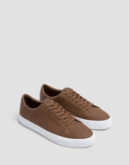 white and brown trainers