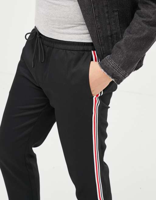 Black trousers with on sale red and white stripe