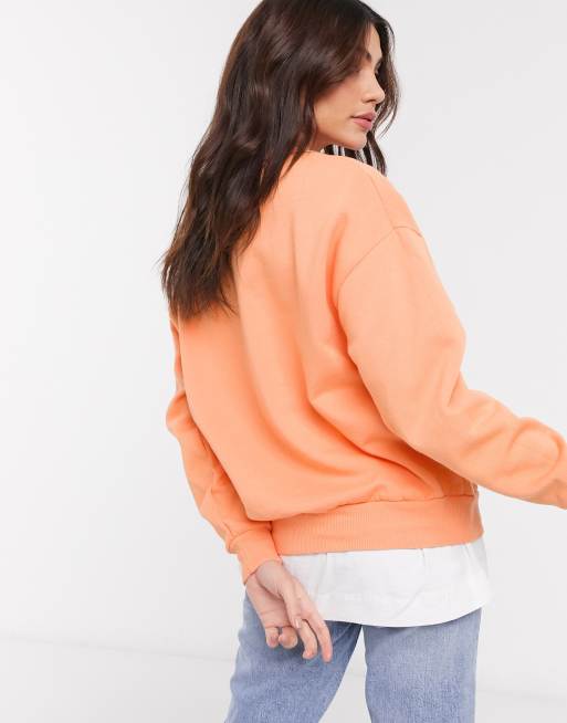 ASOS DESIGN oversized sweatshirt in neon orange