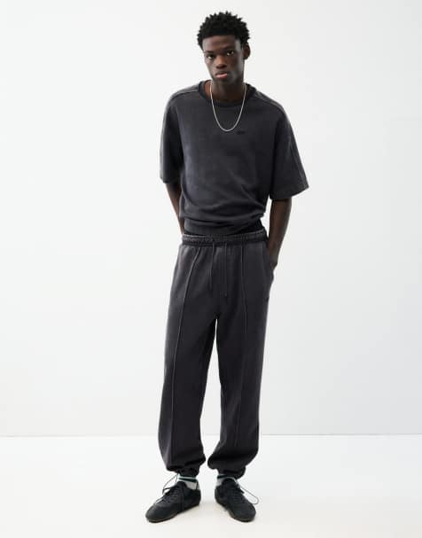Pull&Bear Washed-effect jogger trousers in black - view 1