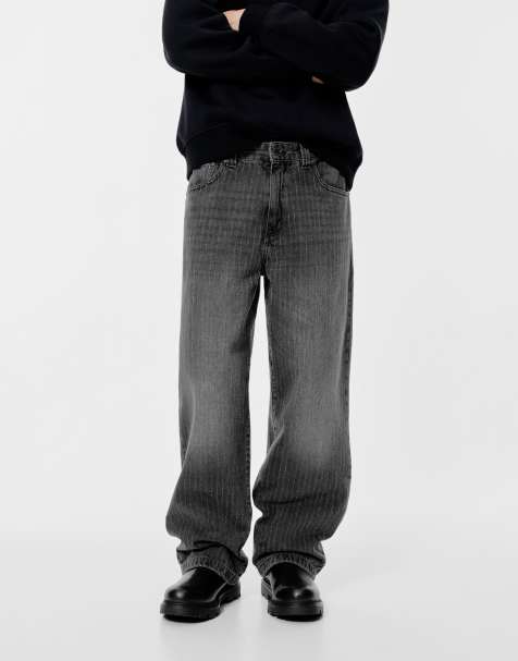 Pull&Bear – Weit geschnittene Jeans in verblasstem Schwarz mit Laser-Print - view 1