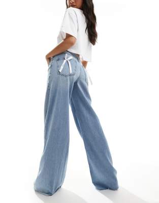 wide fit bow detail jeans in mid blue