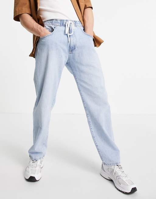 Pull Bear wide leg denim joggers in light wash blue ASOS