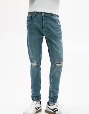 Zerrissene Skinny-Jeans in Neonblau Blau 40