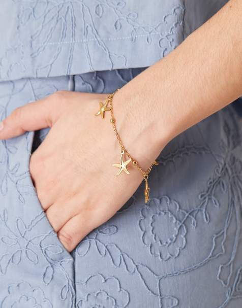 Pulsera con charms de estrellas de mar de acero inoxidable chapada en oro de 18 quilates de Lost Souls - view 1