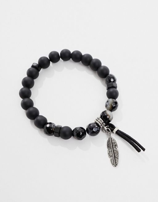 Pulsera de cuentas negras con piedras de ágata y detalle de pluma de FhyzicsShops DESIGN 