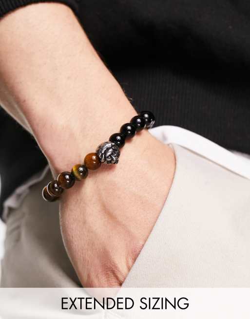 Pulsera de cuentas negras y ojos de tigre con charm de acero inoxidable en forma de león de ASOS DESIGN   