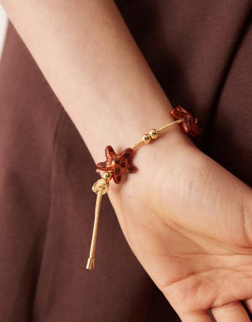 Pulsera de la amistad dorada con detalles de estrellas de mar efecto carey de ASOS DESIGN, 3 de 3