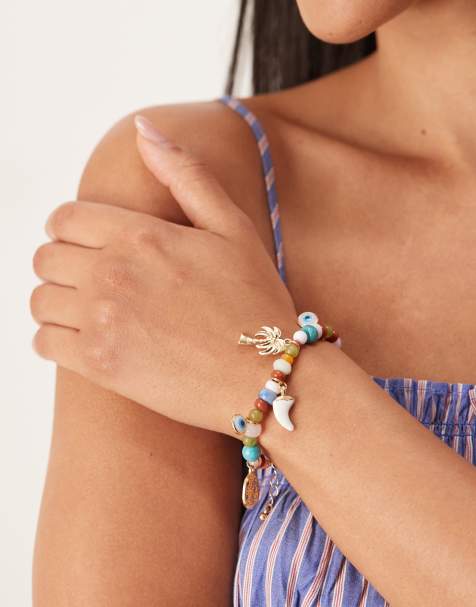 Pulsera dorada con charms y cuentas de ASOS DESIGN - view 1