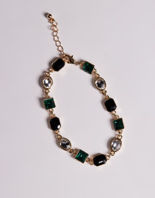 Pulsera dorada con cristales y gemas negras y verde esmeralda de ASOS DESIGN, 2 de 3