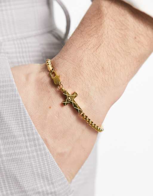 Pulsera dorada con cruz biselada de acero inoxidable de Icon Brand