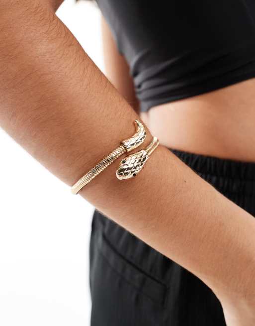 Pulsera dorada con diseño cruzado y detalle de serpiente de ASOS DESIGN, 2 de 4