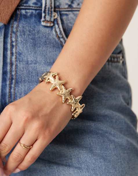Pulsera dorada con diseño de estrellas de mar de Accessorize - view 1