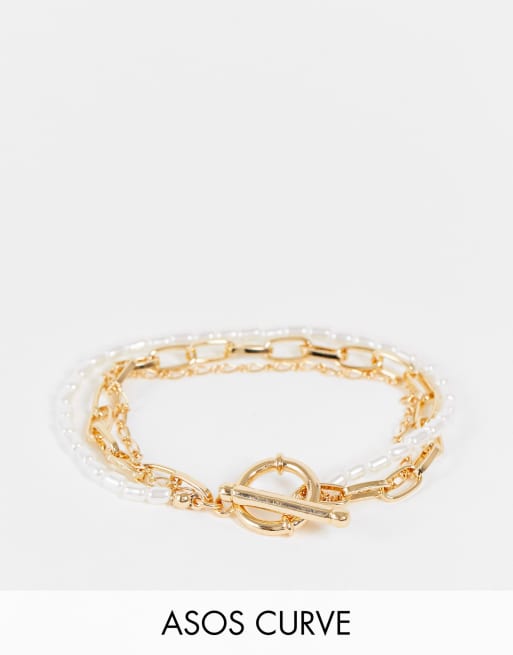 Pulsera dorada de varias hileras con perlas y diseño de cadenas variadas de ASOS DESIGN Curve