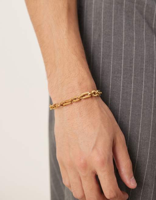 Pulsera dorada estilo cadena de eslabones ovalados de acero inoxidable resistente al agua de ASOS DESIGN