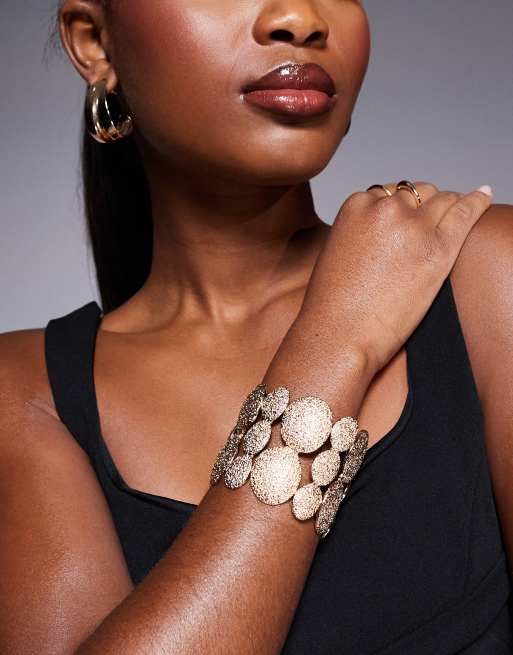 Pulsera dorada rígida con detalles circulares texturizados de ASOS DESIGN