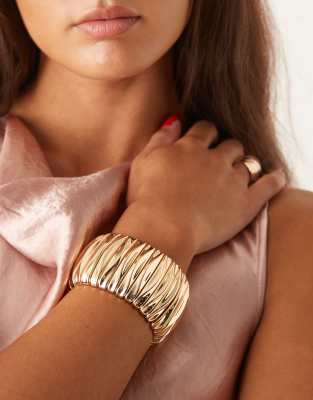 Pulsera gruesa dorada elástica de ASOS DESIGN - view 1