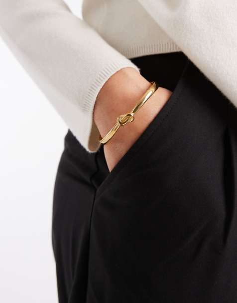 Pulsera rígida dorada con detalle de nudo de acero inoxidable resistente al agua de ASOS DESIGN - view 1