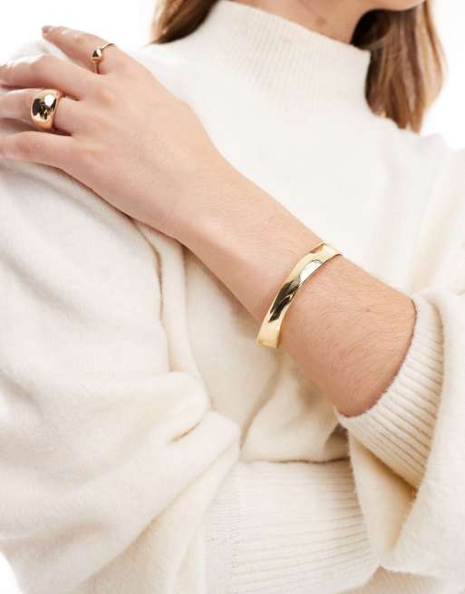 Pulsera rígida dorada de Mango