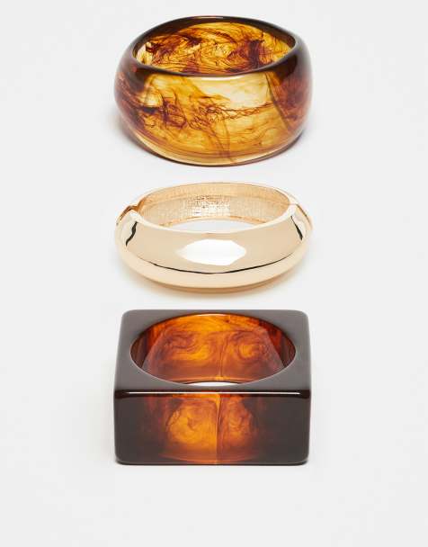 Pulseras con diseños y formas variados de tono dorado y ámbar de resina de ASOS DESIGN - view 1