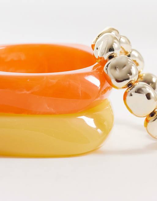 Pulseras de color naranja, amarillo y dorado rígidas apilables Sunvibes de ALDO, 2 de 3