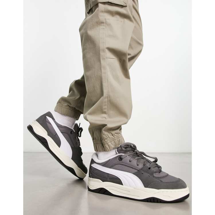 Puma 180 sneakers in dark gray with white detail | ASOS