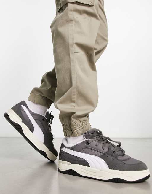 Puma 180 sneakers in dark gray with white detail | ASOS